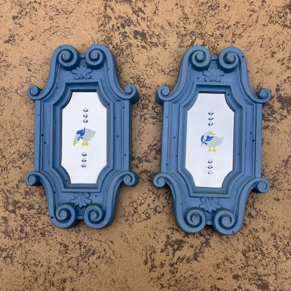 Blue Ornate Wall Mirrors with white duck on mirror